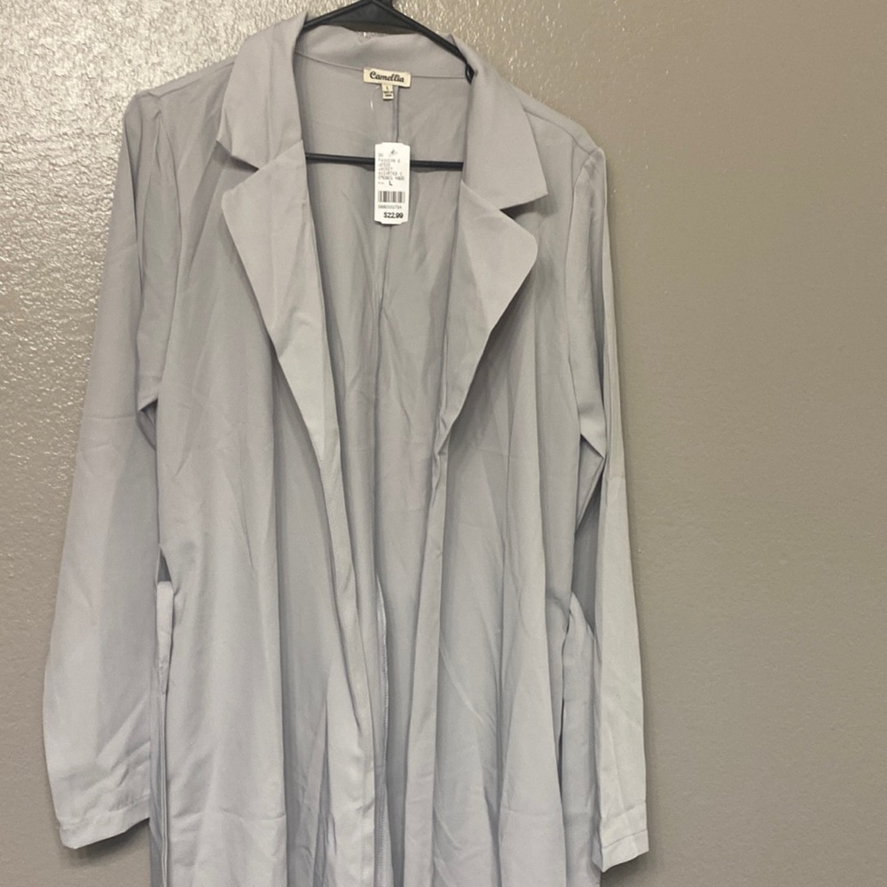 A grey trench coat never worn